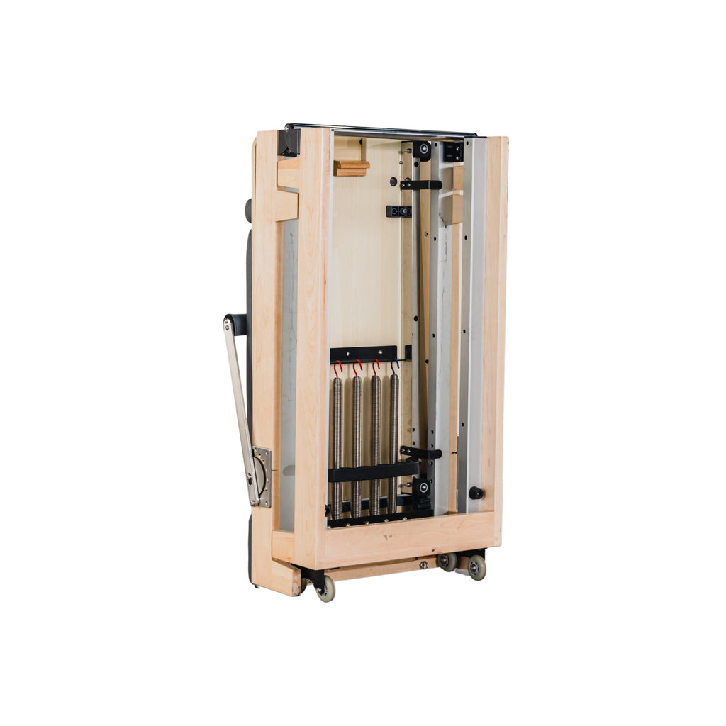 Compact pilates reformer for studio or home workouts