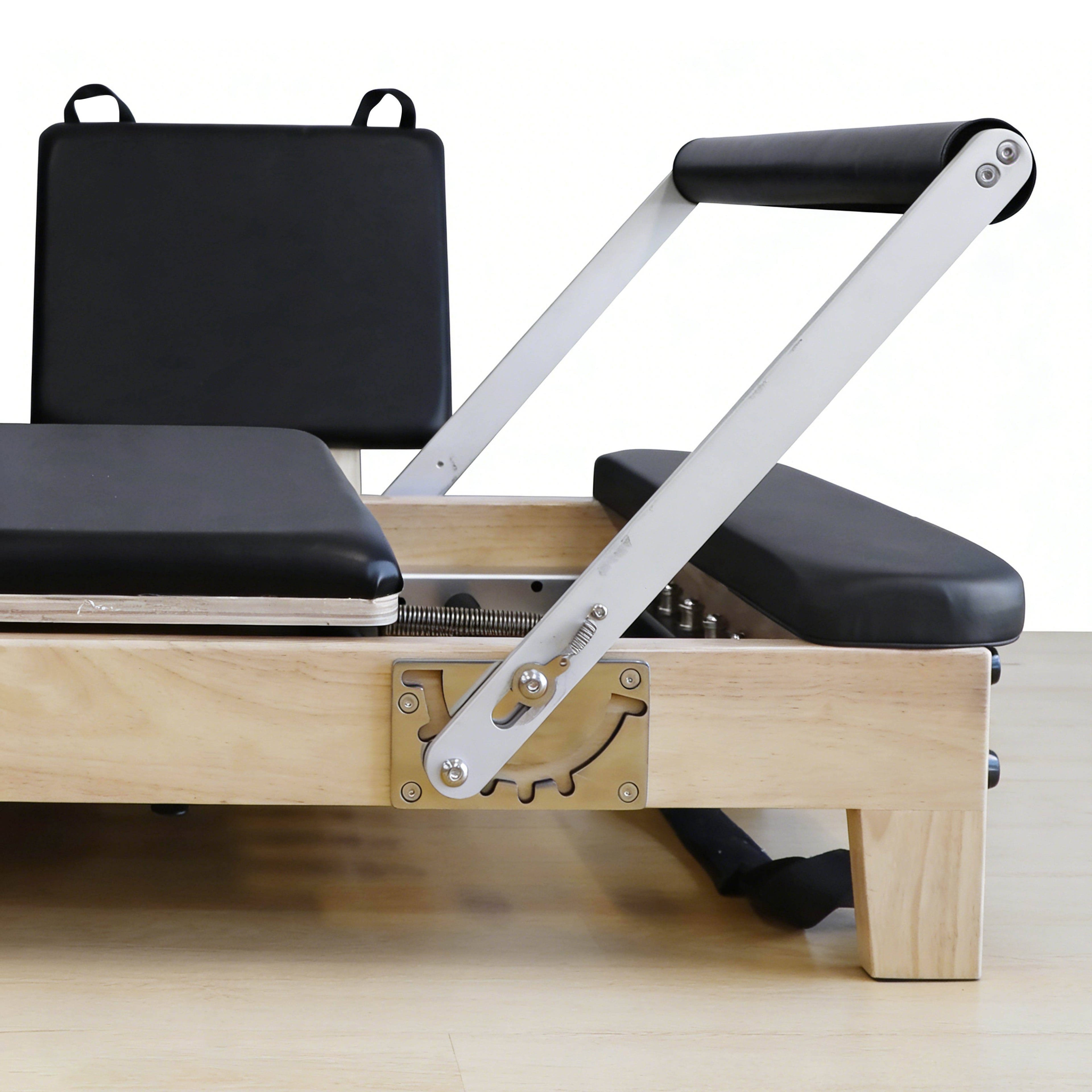 Pilates reformer carriage and headrest in natural oak