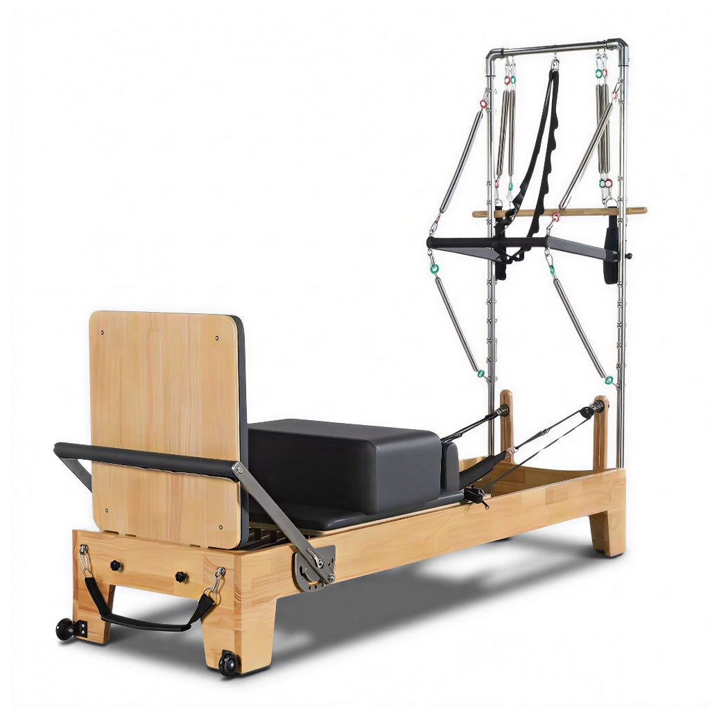 Pilates reformer with half trapeze and oak wood frame, full view