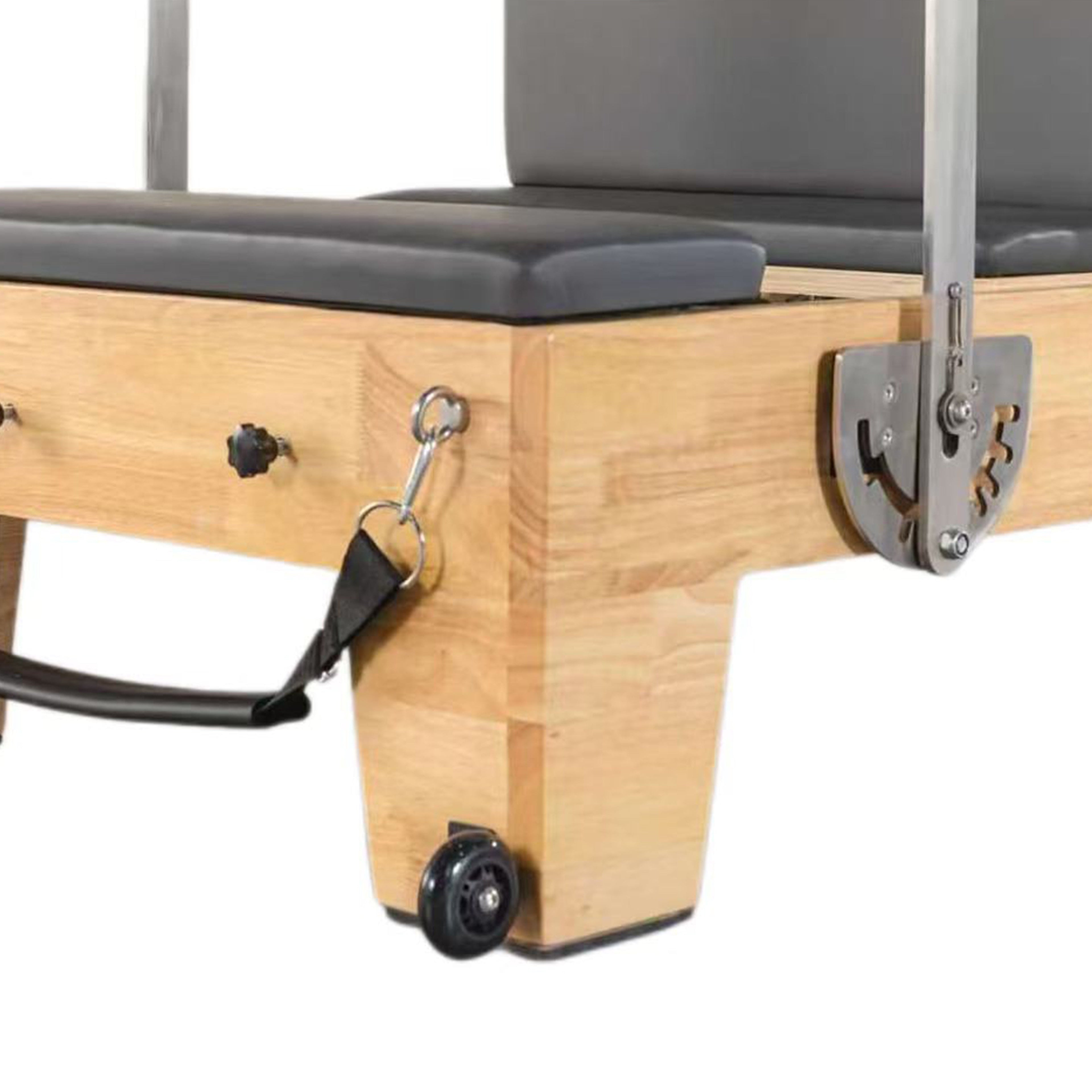 Half trapeze bar detail on oak wood pilates reformer