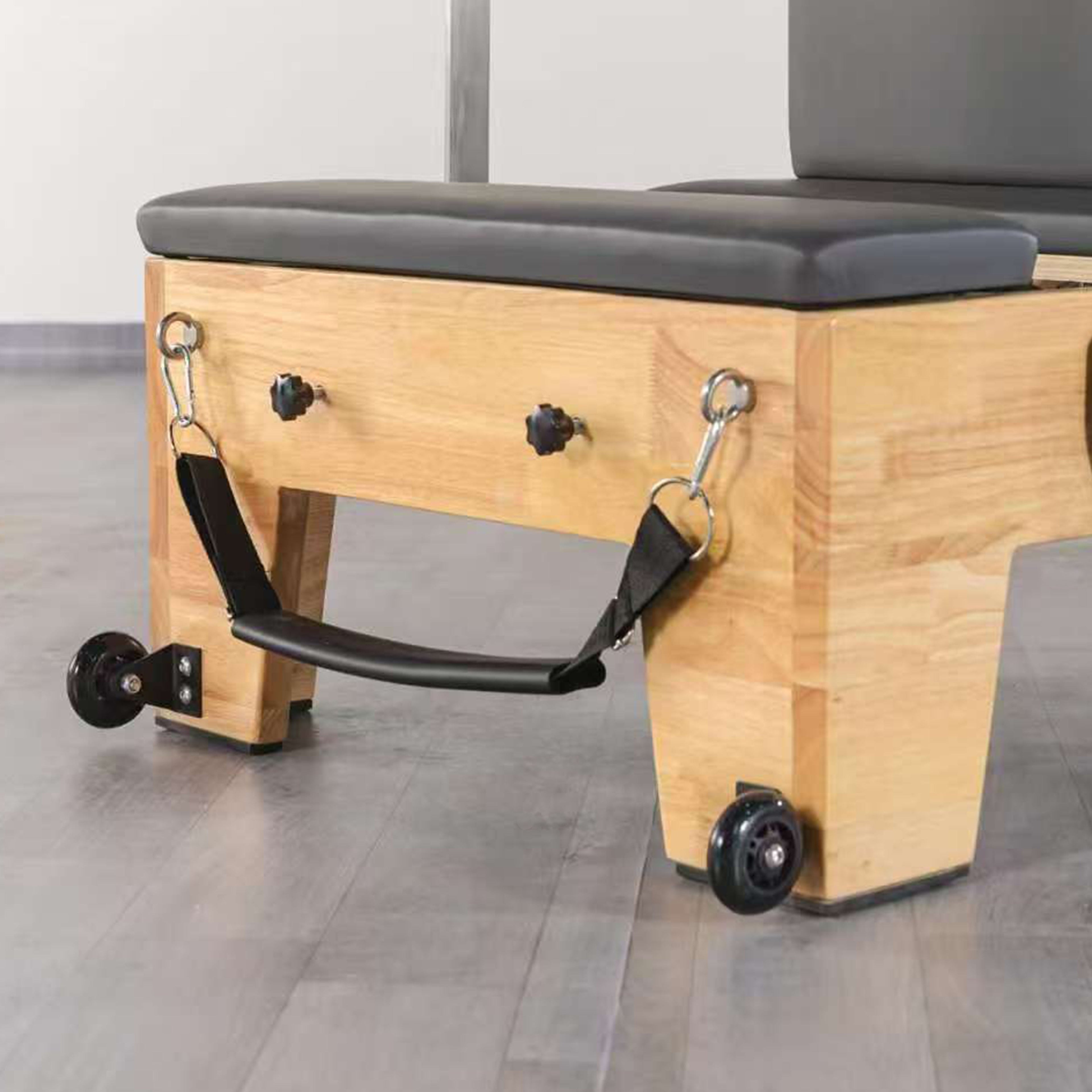 Carriage and spring system on oak wood pilates reformer
