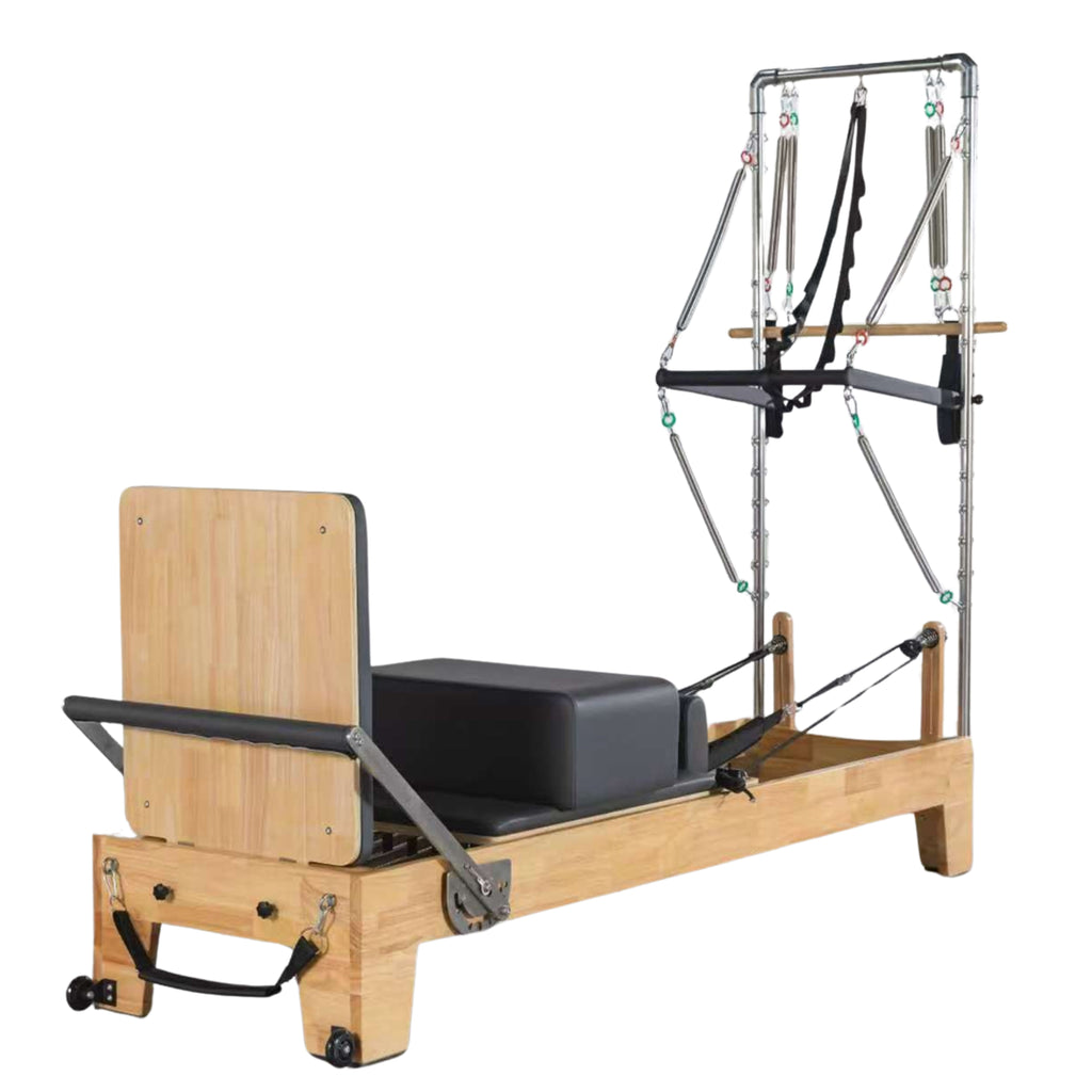 Oak wood pilates reformer featuring half trapeze bar attachment